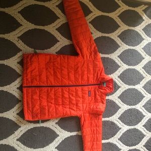 Orange Patagonia nano puff jacket